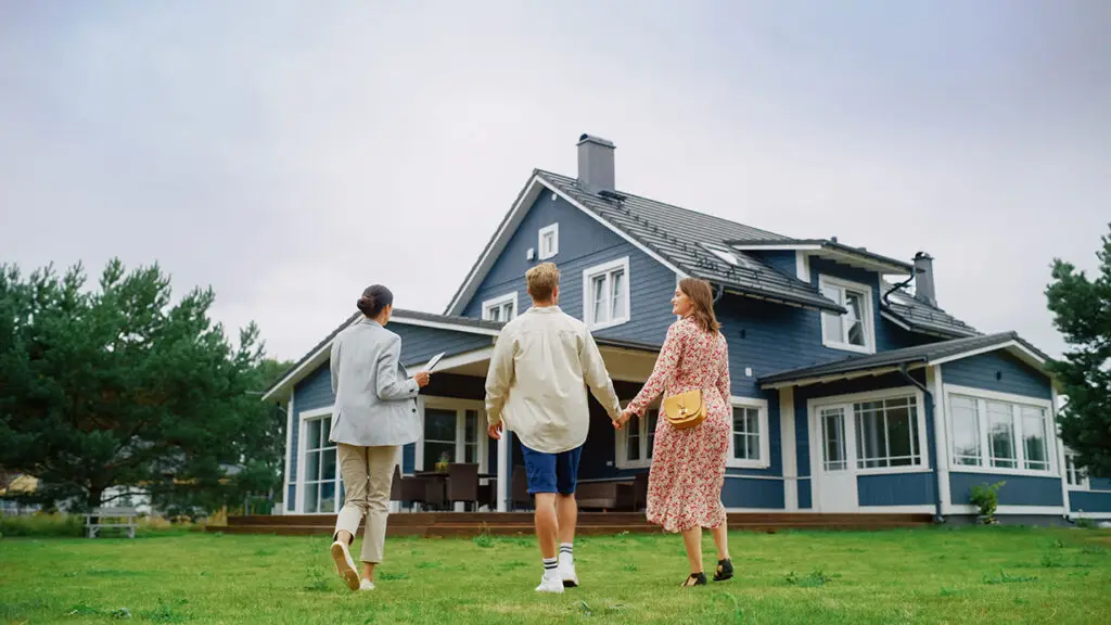 real estate agent showing a house