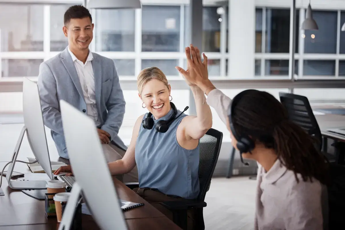 Sales Team High fiving