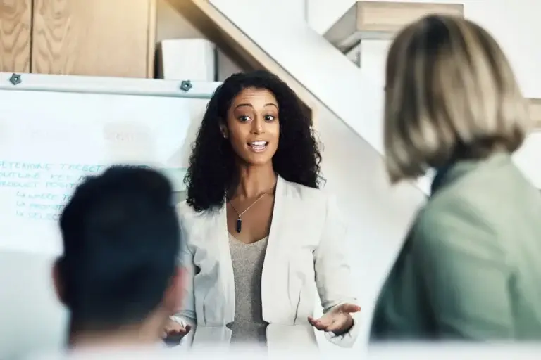 Professional presenting infront of a whiteboard