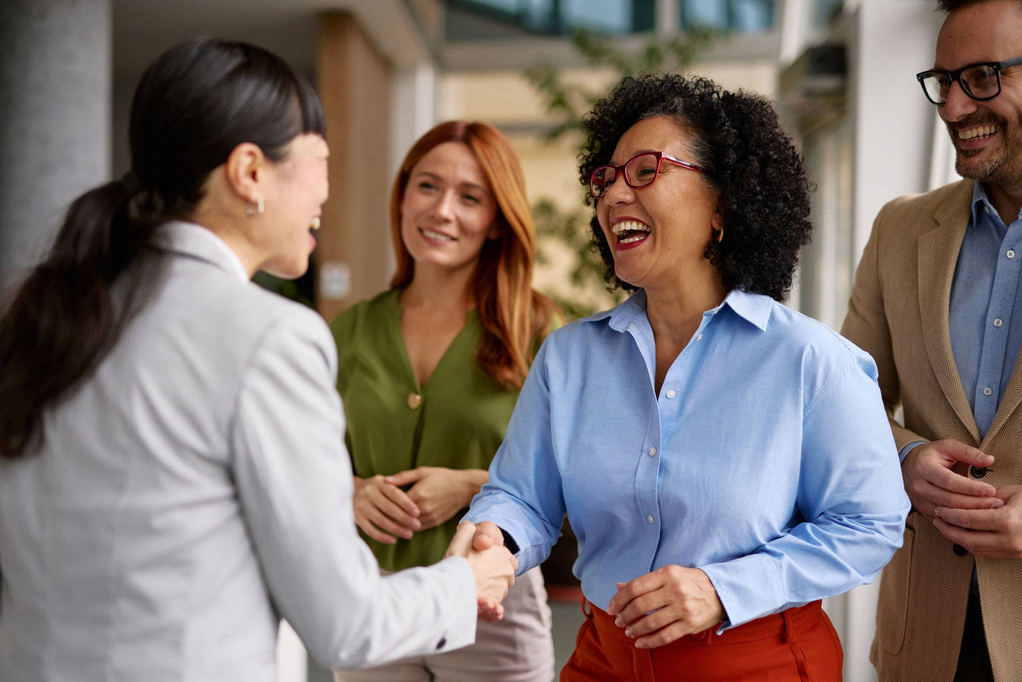 Business Colleagues Shaking Hands in a Modern Office