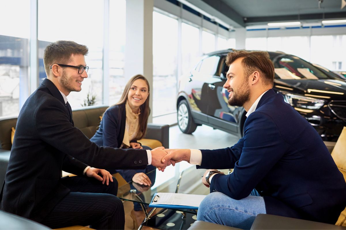 Sales representative shaking hands with a customer